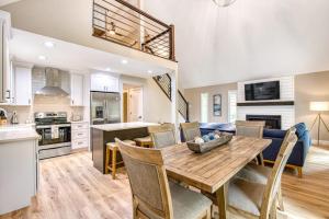 a kitchen and living room with a wooden table and chairs at Wildwood in Fletcher