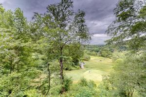 an overhead view of a golf course with a tree at Link Vacation in Whittier