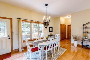 a dining room with a white table and chairs at Link Vacation in Whittier