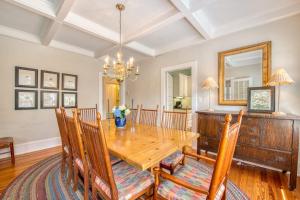 a dining room with a wooden table and chairs at Chapel Side in Lake Junaluska +68 photos
