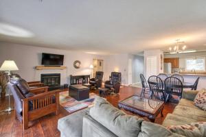 a living room with a couch and a table at Beehive Condo in Lake Junaluska