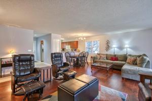a living room with a couch and a table at Beehive Condo in Lake Junaluska