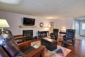 a living room with a couch and a fireplace at Beehive Condo in Lake Junaluska