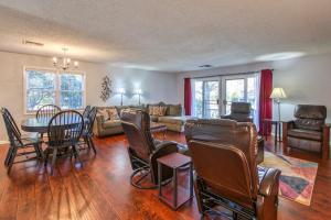 a living room with a table and chairs at Beehive Condo in Lake Junaluska
