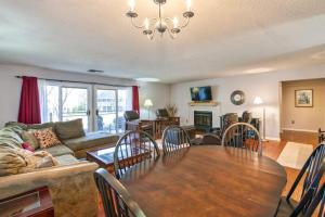 a living room with a table and a couch at Beehive Condo in Lake Junaluska +34 photos