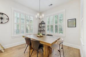 a dining room with a wooden table and chairs at Downtown Delight in Brevard