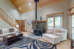 a living room with a couch and a fireplace at Rhymer Haven in Juno