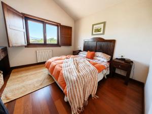 a bedroom with a large bed and a window at Vila Xocas in Baiona +31 photos