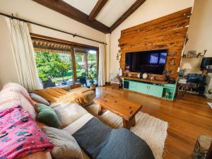 a living room with a couch and a table at Vila Xocas in Baiona