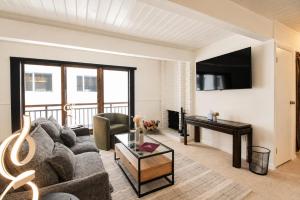 a living room with a couch and a table at Central Aspen Condo - Affordable & Prime Location in Aspen