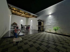 a room with a fireplace and a table and chairs at Holiday Home with Private Pool in Blagaj