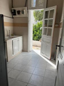 an open door to a kitchen with an open doorasteryasteryasteryasteryasteryastery at 3 bedroom Villa with garden in Ez Zahra