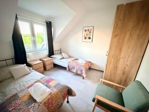 a bedroom with two beds and a window at Lisia Górka in Debina