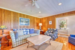 a living room with a couch and a table at Cameron Lakeside in Lake Junaluska
