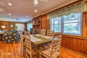 a dining room with a table and chairs at Cameron Lakeside in Lake Junaluska