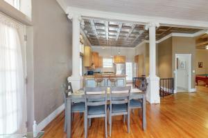 a dining room with a table and a kitchen at Mountain Stream Haven in Whittier