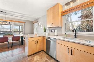 a kitchen with a sink and a dishwasher at Upper Lakeshore Living in Lake Junaluska +36 photos