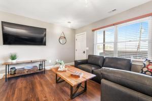 a living room with a couch and a table at Lower Lakeshore Living in Lake Junaluska