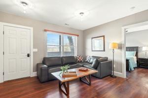 a living room with a couch and a table at Lower Lakeshore Living in Lake Junaluska