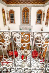 a view from the balcony of a room with windows at Riad Fes iline Medina in Fez