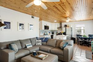 a living room with a couch and a kitchen at LT04FLR Torchbearer - Lower in Little Torch Key
