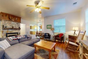 a living room with a couch and a table at Mountain Hideaway in Sylva