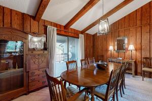 a dining room with a wooden table and chairs at Riverhill Ridge in Sylva +44 photos
