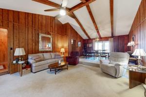 a living room with a couch and chairs and a table at Riverhill Ridge in Sylva