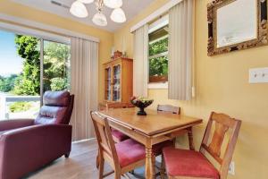a dining room with a table and chairs and a couch at 2 Bed 1 Bath Vacation home in Sylva in Sylva