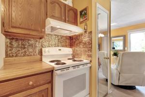 a kitchen with a white stove top oven in a caravan at 2 Bed 1 Bath Vacation home in Sylva in Sylva +11 photos