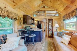 a living room and kitchen in a tiny house at Deimos Cabin in Mars Hill
