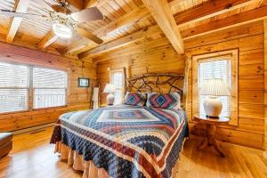 a bedroom with a bed in a log cabin at Timberidge Lodge in Sylva