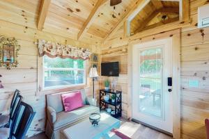 a living room with a couch and a table at Phobos Cabin in Mars Hill