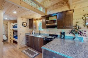 a kitchen with a counter top in a cabin at Phobos Cabin in Mars Hill +19 photos