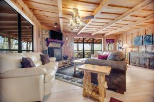 a living room with a couch and a table at Black Bear Cabin Fox Mountain in Franklin