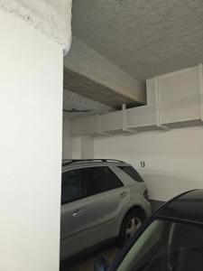 a silver car parked in a parking lot at Duplex Rooftop premium - 4 chambres - Evry in Courcouronnes
