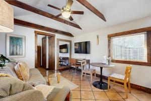 a living room with a couch and a table at Main Street Wood Cottage in Brevard