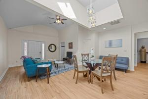 a living room with a blue couch and a table at Hominy Creek Haven in Candler