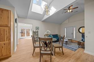 a dining room and living room with a table and chairs at Hominy Creek Haven in Candler