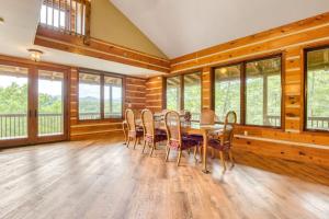 a dining room with a table and chairs at Close to Heaven in Sylva