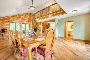 a dining room with a wooden table and chairs at Close to Heaven in Sylva