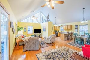 a living room with a couch and a table at Tree Top Cabin in Sylva