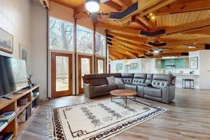 a living room with a couch and a table at Red Fox Lair in Franklin