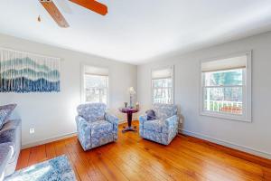 a living room with two chairs and a table at Brevard Bungalow in Brevard