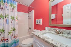 a bathroom with a sink and a toilet and a shower at The Dunes 503 in Gulf Shores