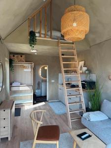 a room with a bunk bed and a couch at Cozy cottage with a view in Hella +30 photos