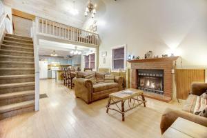 a living room with a couch and a fireplace at Along the River Cottage in Cullowhee