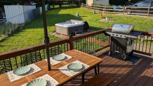a grill and a picnic table on a deck at Blueridge Brew View in Fairview