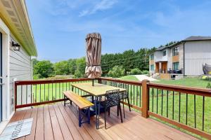 a wooden deck with a table and chairs on it at Blueridge Brew View in Fairview
