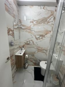 a bathroom with a sink and a toilet at TAJ ROOM center altea #D in Altea